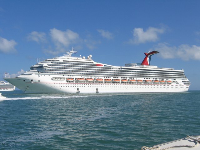 Approaching Carnival Glory anchored off Belize City