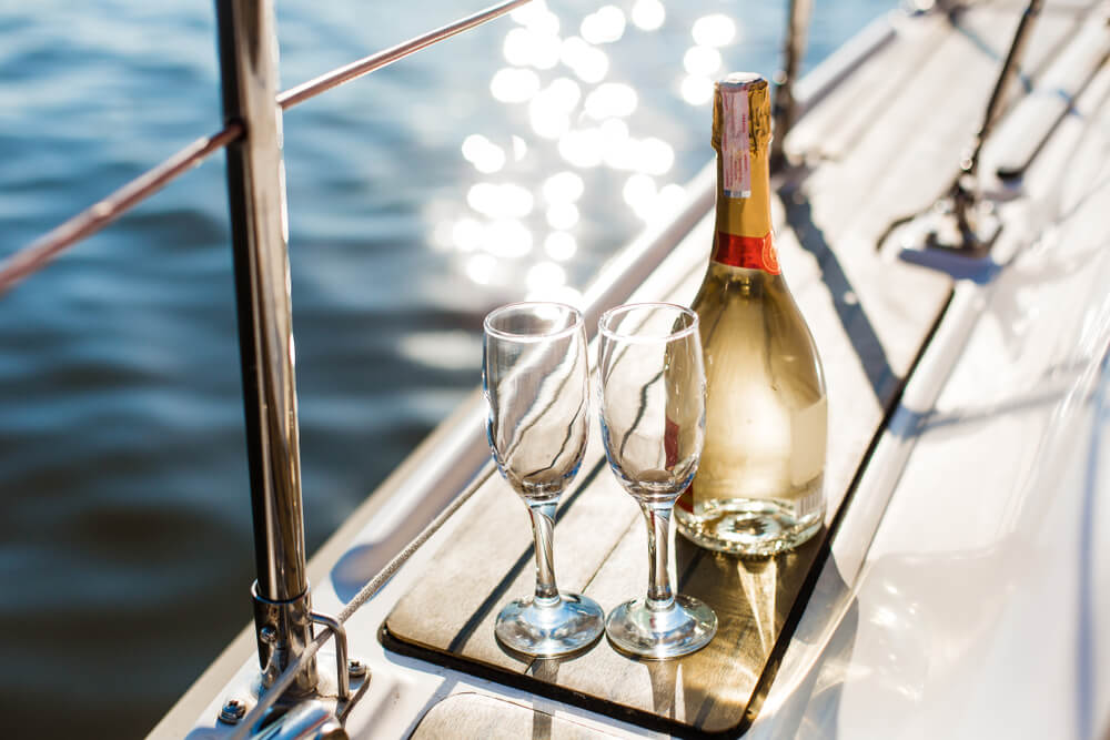 Empty glasses and bottle with champagne - addon costs for cruise