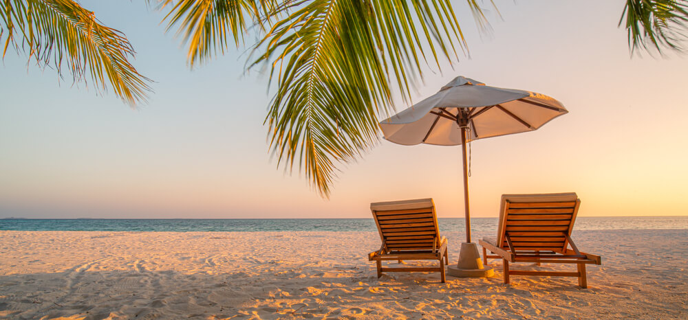 Chairs on the sandy beach near the sea
